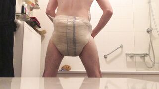 Removing a piss and shit filled diaper