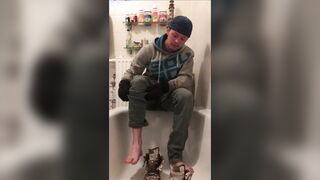 Clothed piss shit fun in bathtub